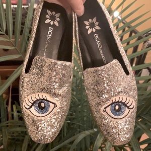 BCBGeneration Sparkling Mules with eye patch detail.
